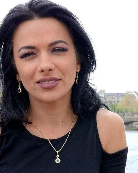 Shalina Devine in Paris with the Eiffel Tower behind her